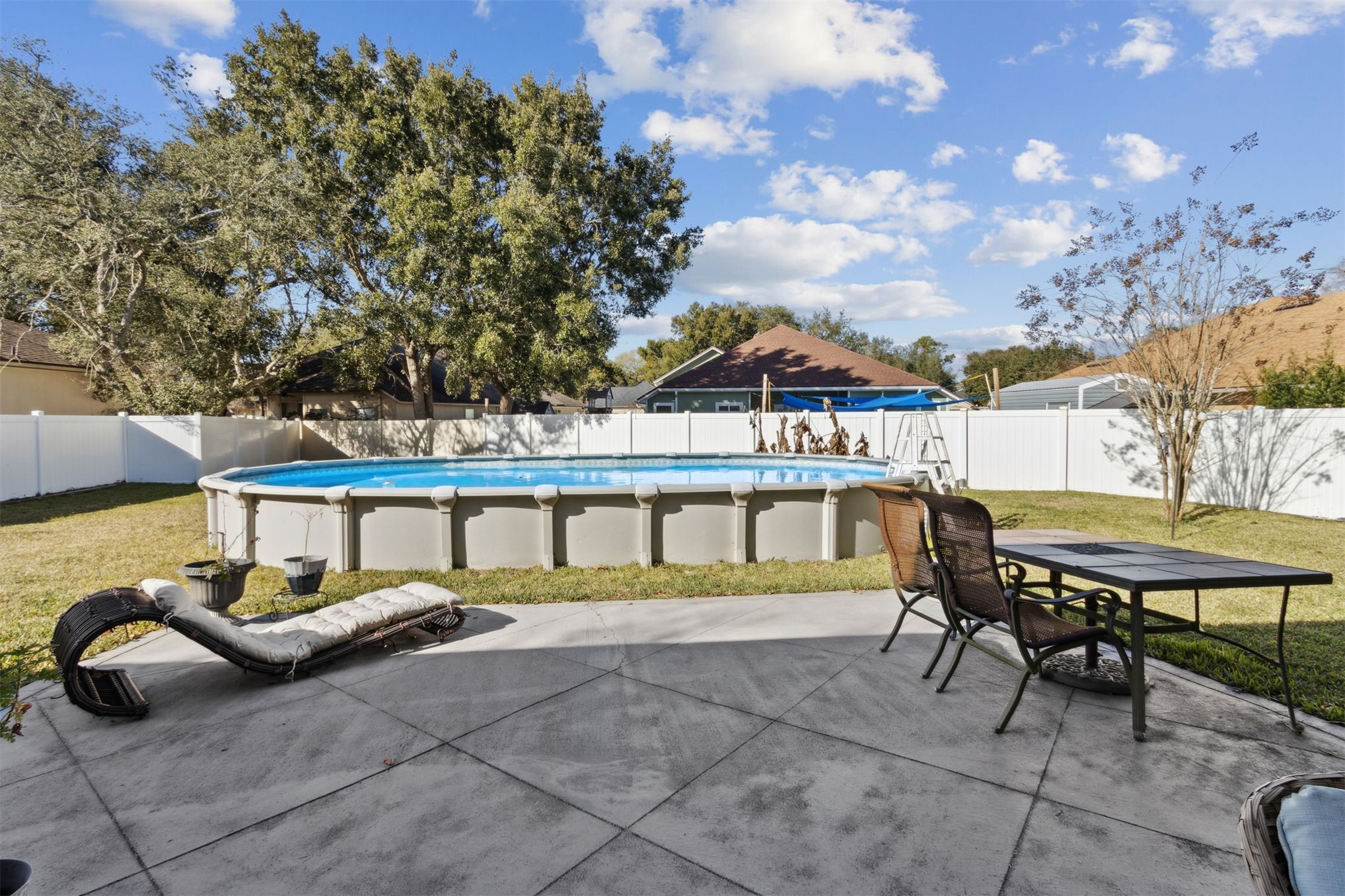 86027 Maple Leaf Place Yulee, FL 32097 - Photo 34 of 38 a view of a chairs and table in the patio