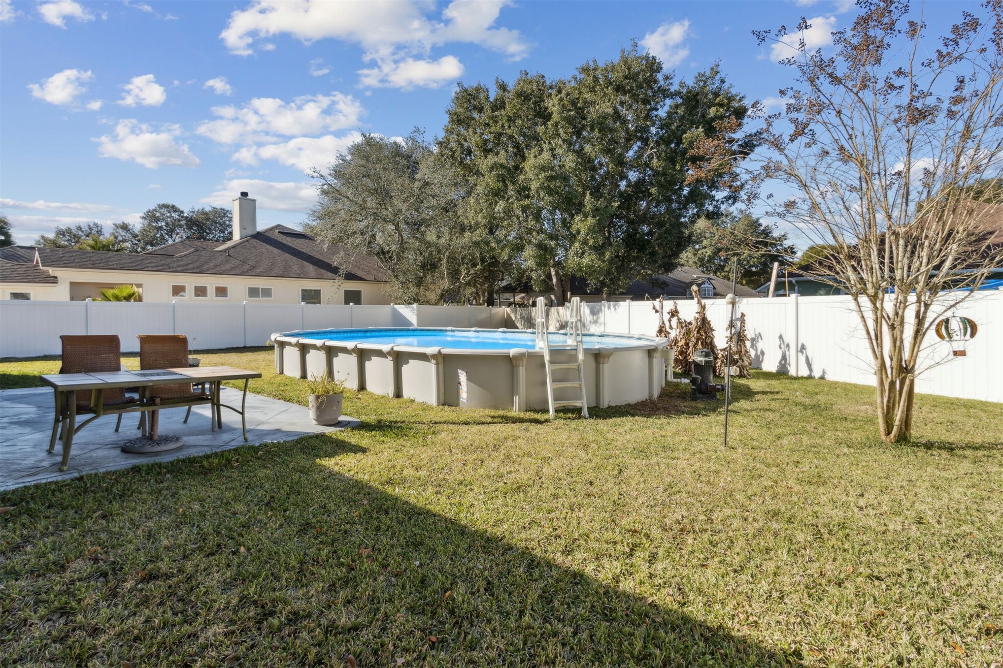 86027 Maple Leaf Place Yulee, FL 32097 - Photo 36 of 38 a view of a house with backyard and sitting area