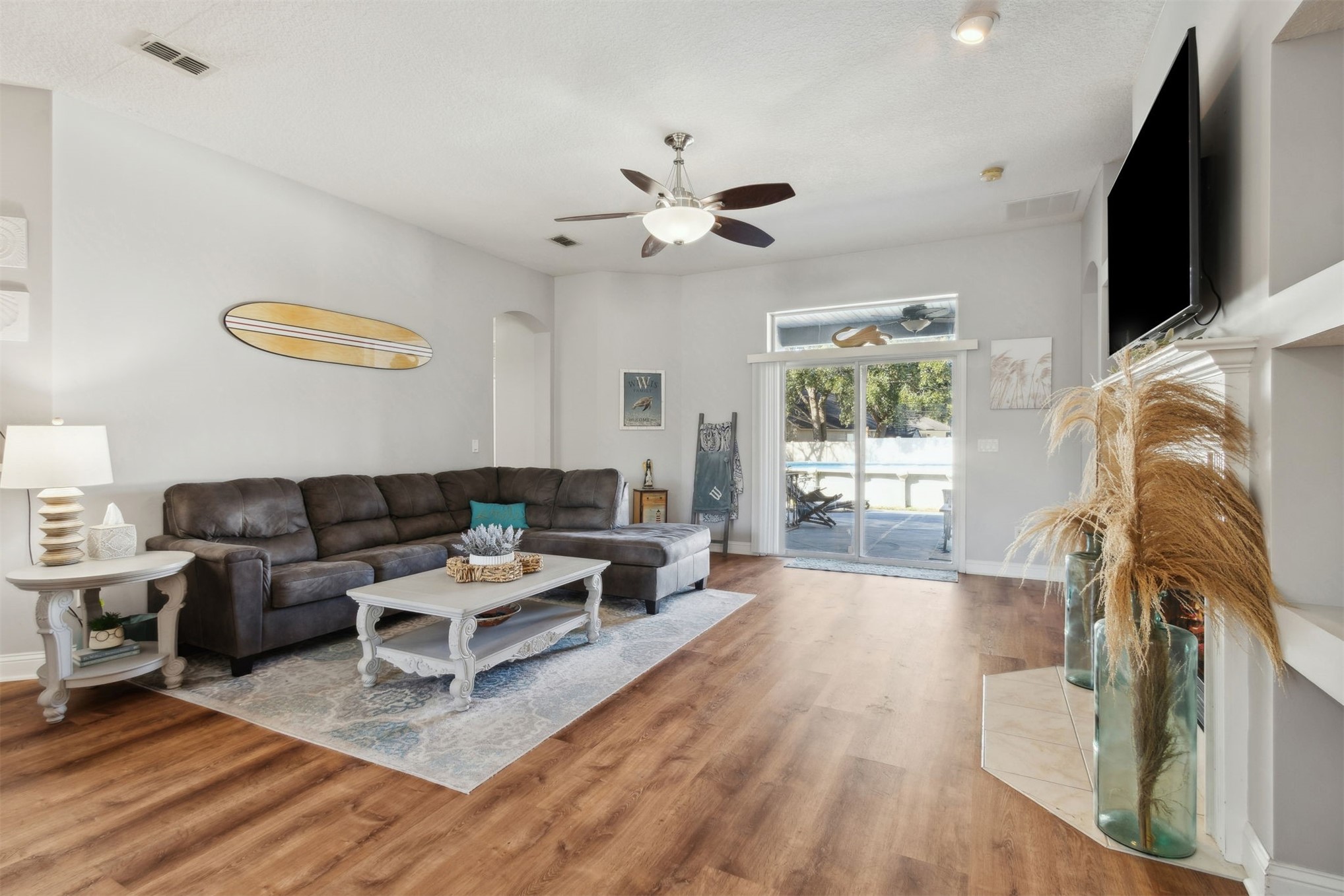 86027 Maple Leaf Place Yulee, FL 32097 - Photo 8 of 38 a living room with furniture and a flat screen tv