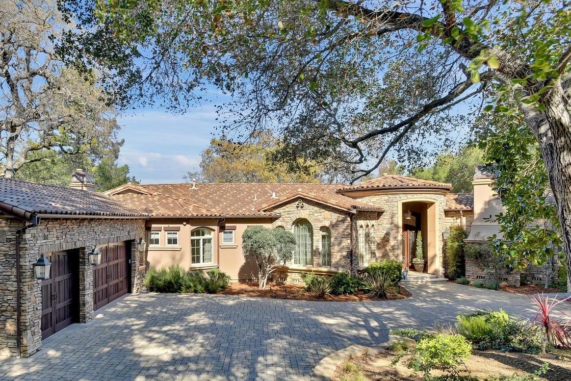 18485 Withey Road Monte Sereno, CA 95030 - Photo 1 of 39 a view of a house with large trees and plants