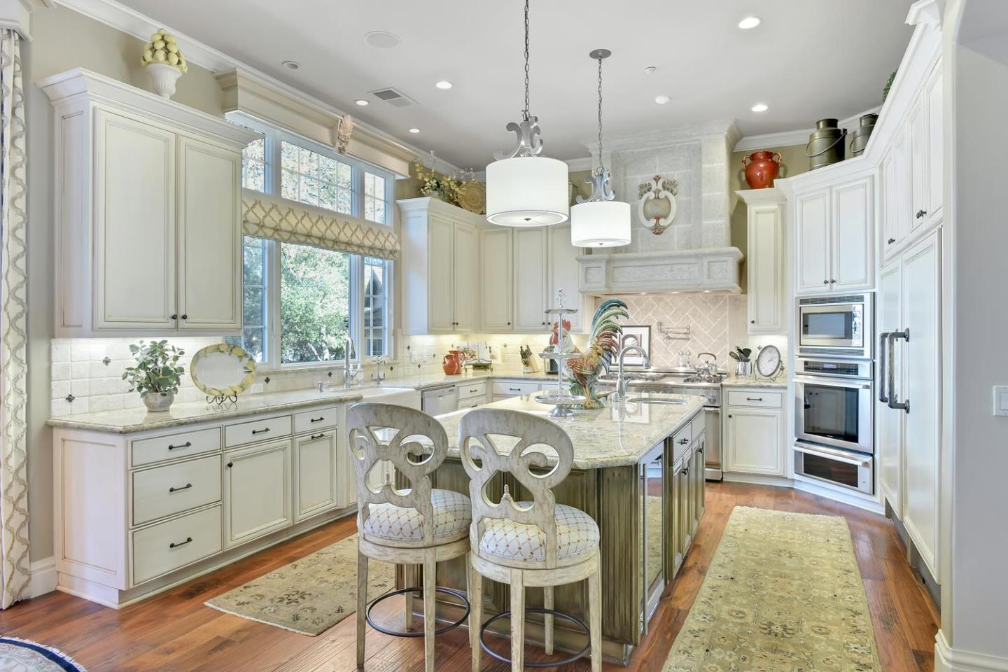 18485 Withey Road Monte Sereno, CA 95030 - Photo 11 of 39 a large kitchen with lots of counter space and stainless steel appliances