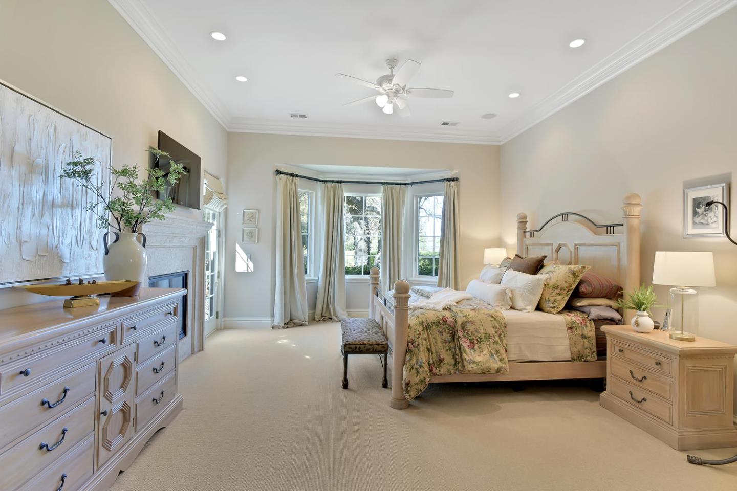 18485 Withey Road Monte Sereno, CA 95030 - Photo 18 of 39 a bedroom with furniture and large windows