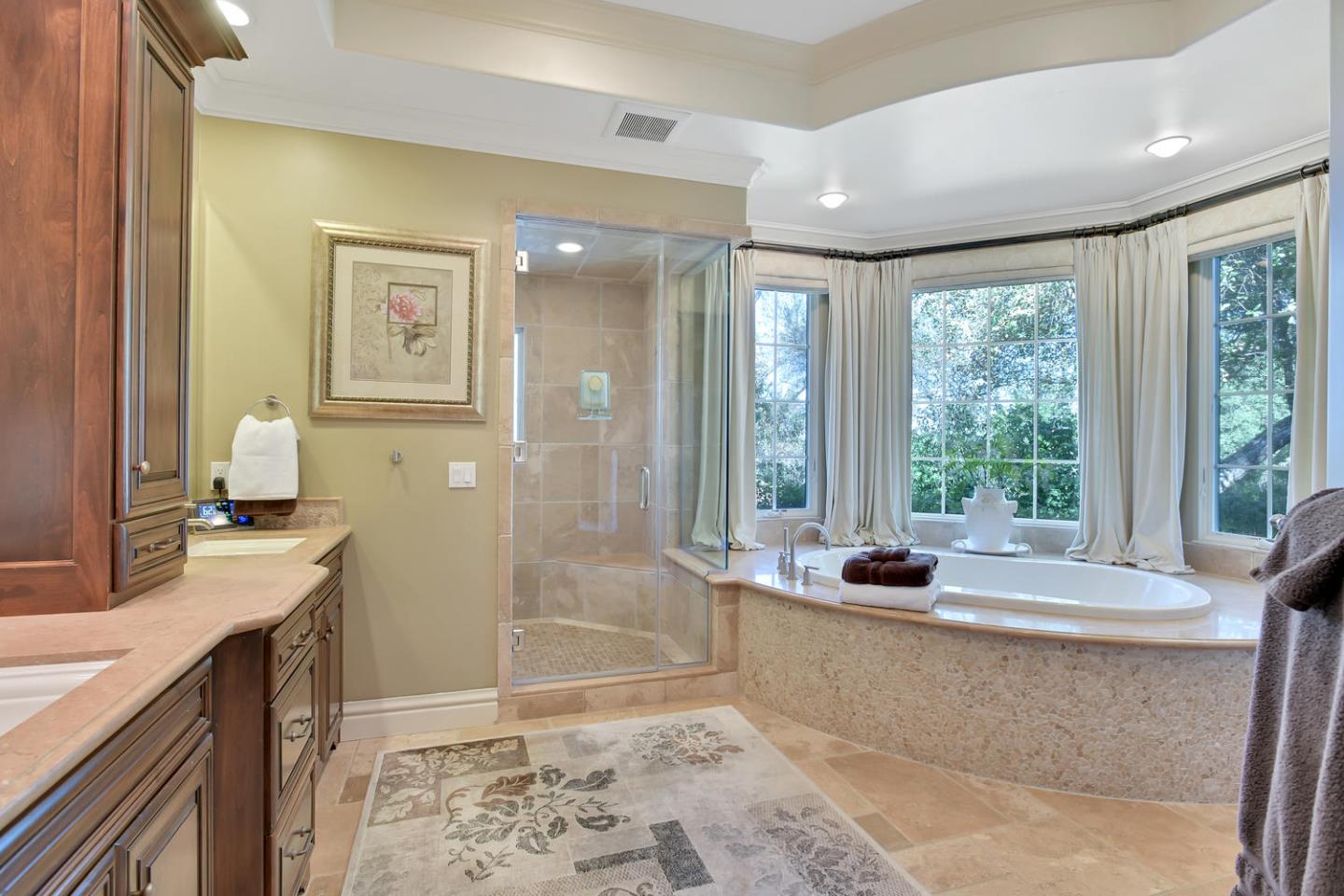 18485 Withey Road Monte Sereno, CA 95030 - Photo 20 of 39 a spacious bathroom with a tub sink and mirror