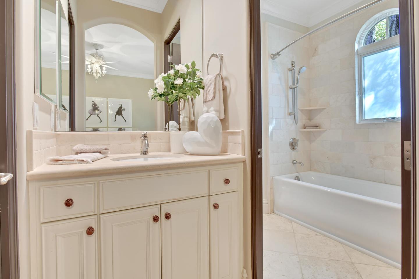 18485 Withey Road Monte Sereno, CA 95030 - Photo 24 of 39 a bathroom with a granite countertop sink a mirror a vanity and a bathtub