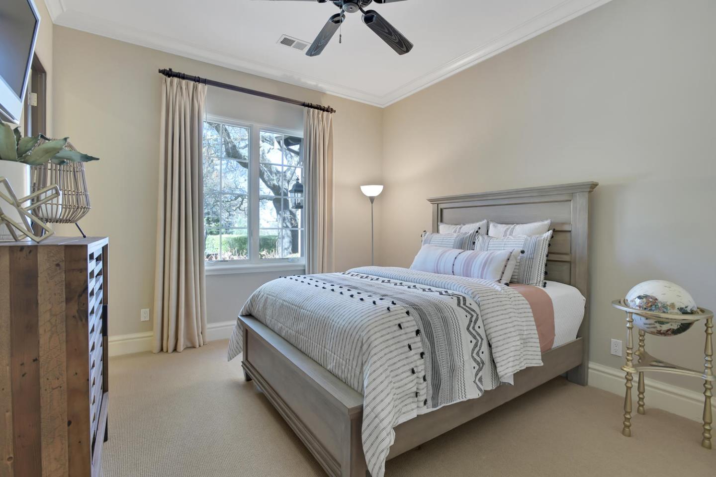 18485 Withey Road Monte Sereno, CA 95030 - Photo 27 of 39 a bed sitting in a bedroom next to a window