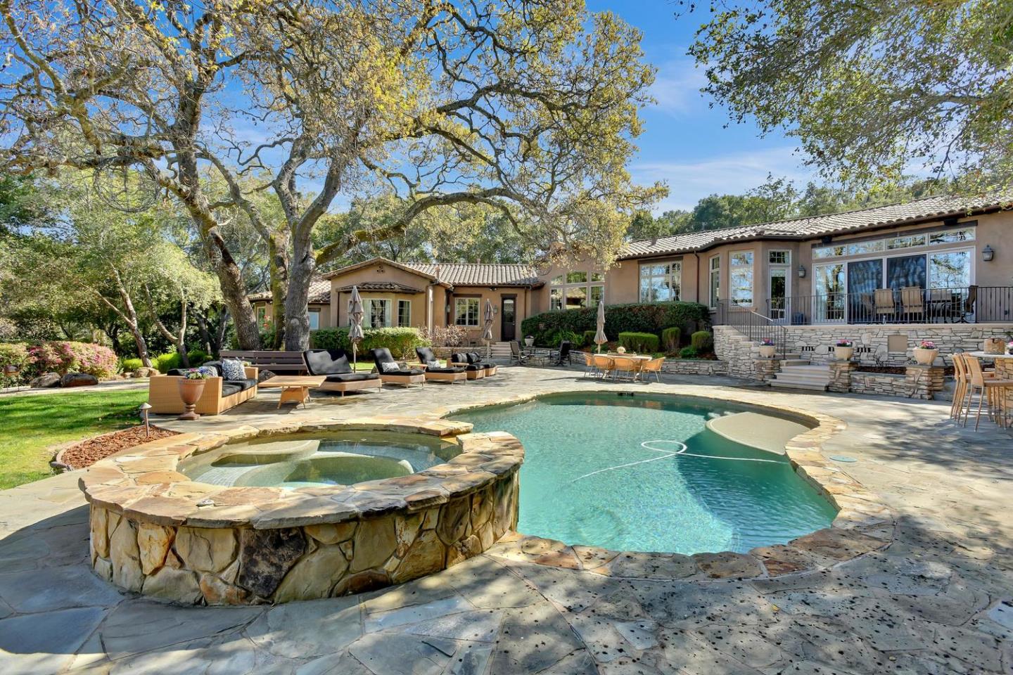 18485 Withey Road Monte Sereno, CA 95030 - Photo 36 of 39 a view of a house with swimming pool and sitting area