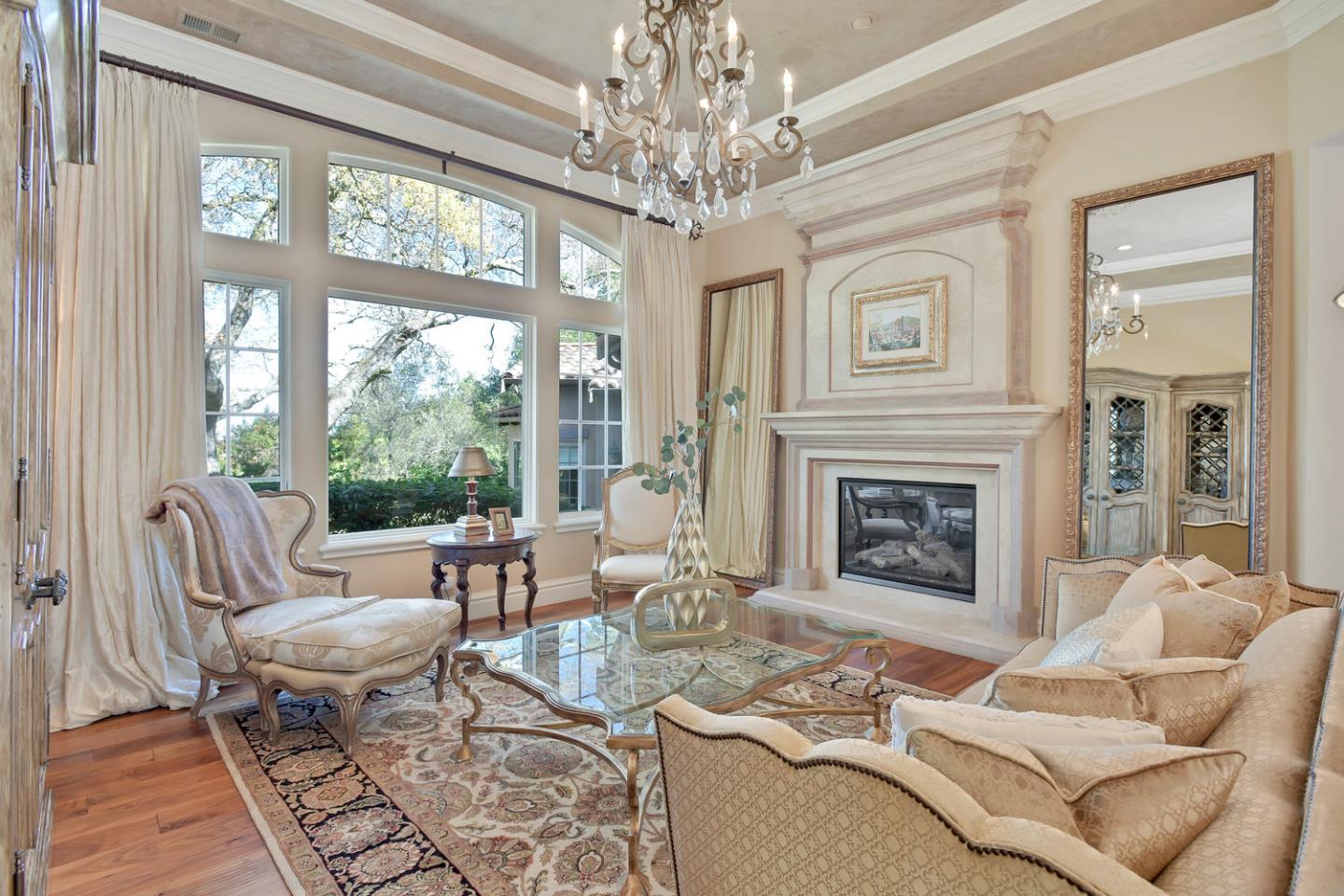 18485 Withey Road Monte Sereno, CA 95030 - Photo 7 of 39 a living room with furniture a chandelier and a fireplace