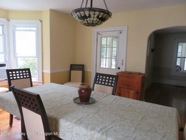 a bedroom with a bed and a table