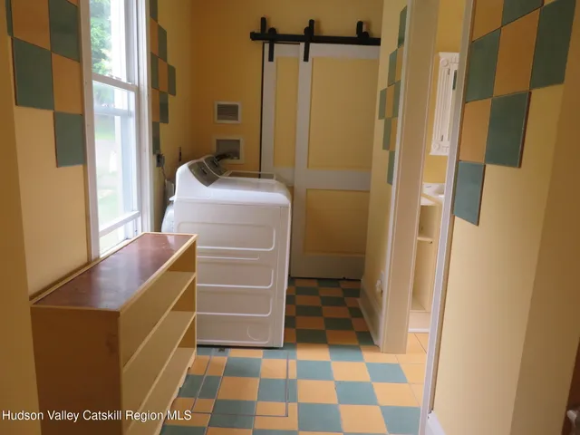 a bathroom with a mirror and a shower