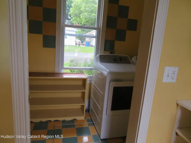 a bathroom with a shower and a sink