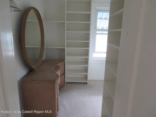 a view of hallway with livingroom and a hallway