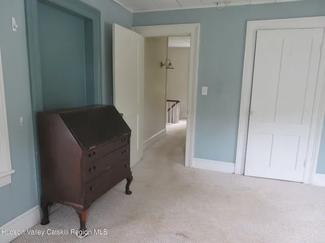 a view of workspace with furniture and a window