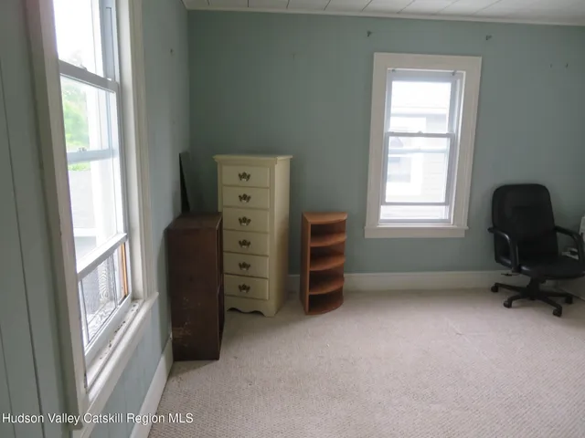 a bathroom with a granite countertop shower and a toilet