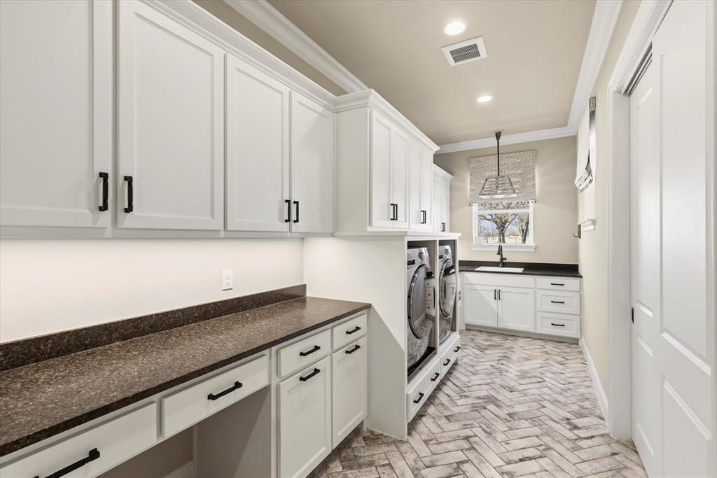 8301 Stephens Ranch Road Pilot Point, TX 76258 - Photo 27 of 40 Laundry room craft room and extra storage room