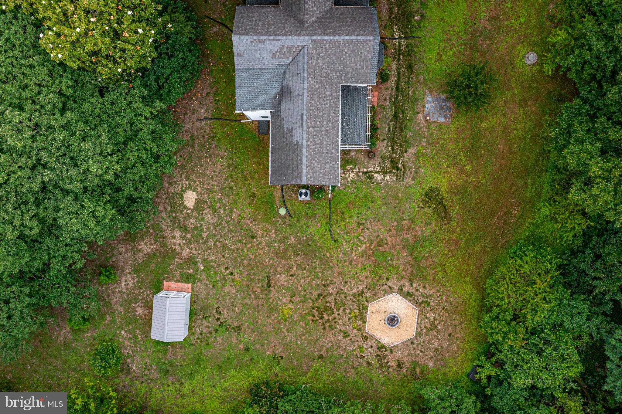 3952 Irvington Road Irvington, VA 22480 - Photo 58 of 77 a aerial view of a house with a yard and large tree
