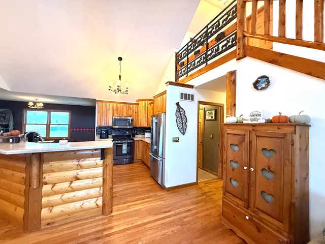 a view of living room with furniture and large windows