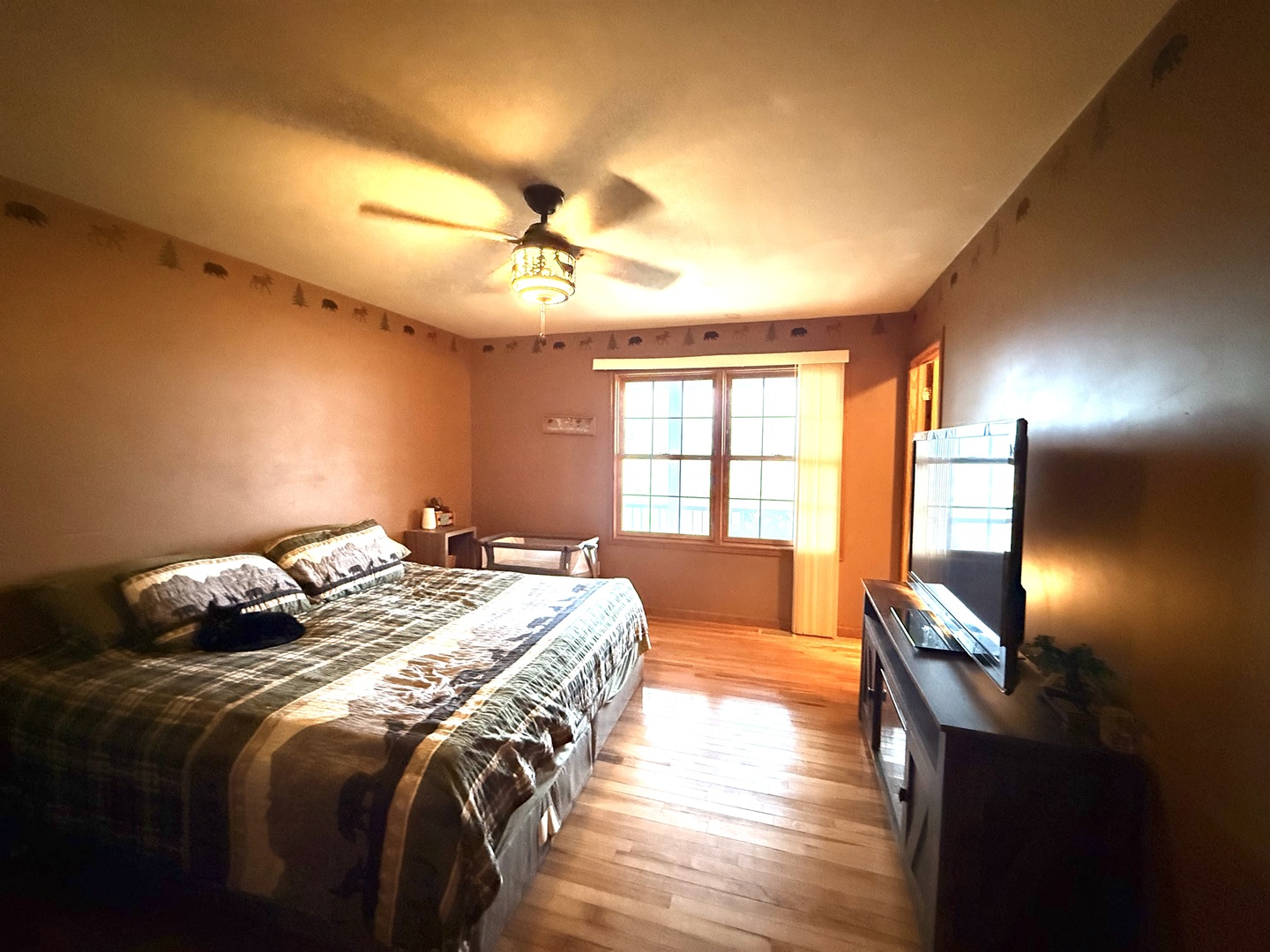 14944 South Steward Road Rochelle, IL 61068 - Photo 16 of 32 a bedroom with a bed and wooden floor