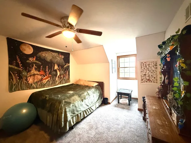 a bed room with a bed and furniture