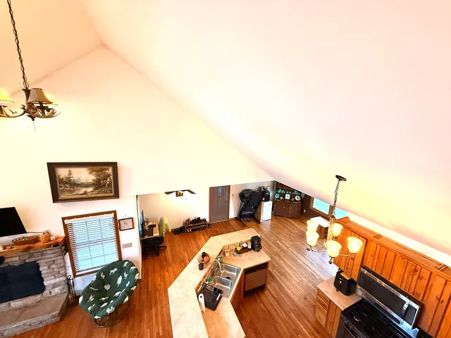 a view of a livingroom with furniture and wooden floor