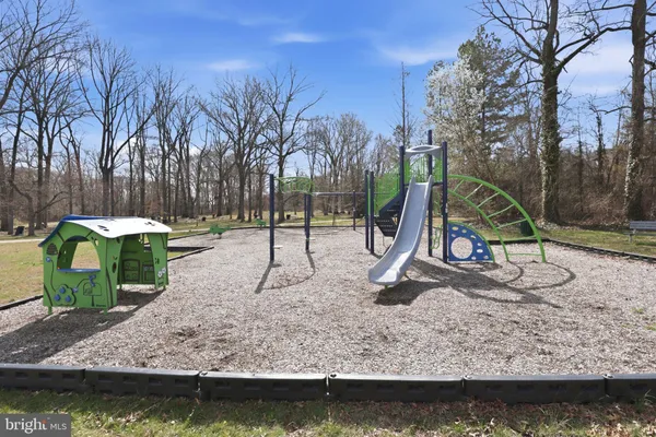 a view of a park with swings and slides