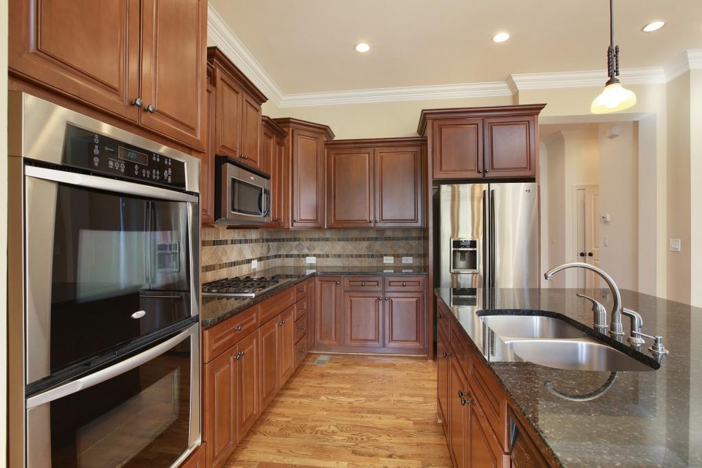 2010 Heathermere Way Roswell, GA 30075 - Photo 13 of 42 a kitchen with stainless steel appliances granite countertop a sink and a refrigerator