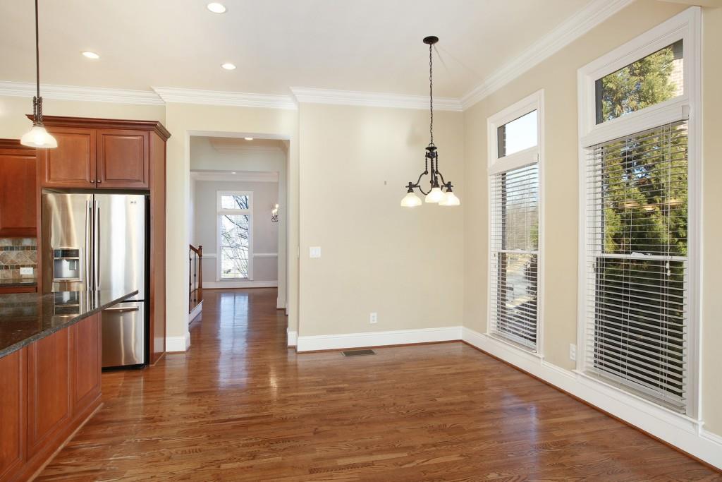 2010 Heathermere Way Roswell, GA 30075 - Photo 16 of 42 a view of a hallway with wooden floor and a bathroom