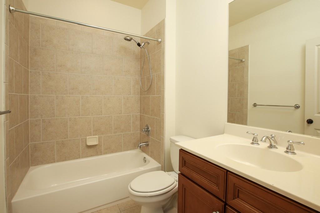 2010 Heathermere Way Roswell, GA 30075 - Photo 25 of 42 a bathroom with a sink a toilet and shower