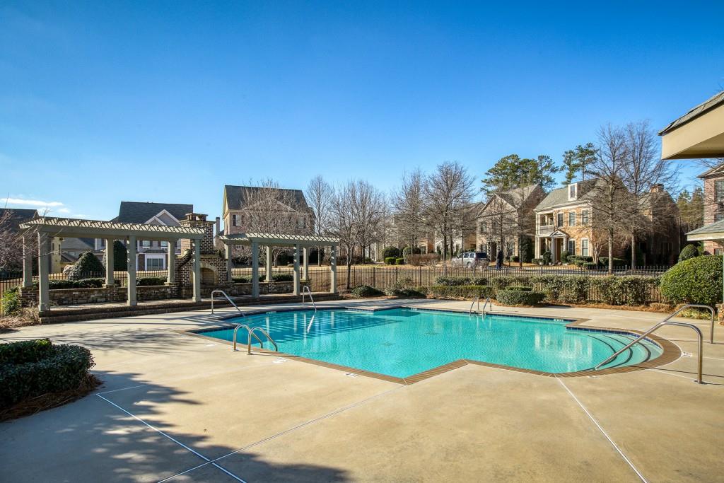 2010 Heathermere Way Roswell, GA 30075 - Photo 3 of 42 a view of a swimming pool with outdoor seating and plants