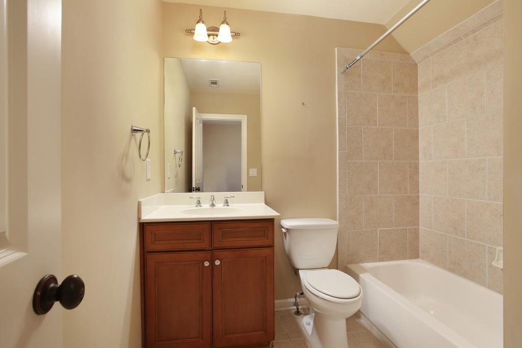 2010 Heathermere Way Roswell, GA 30075 - Photo 35 of 42 a bathroom with a sink a toilet and shower