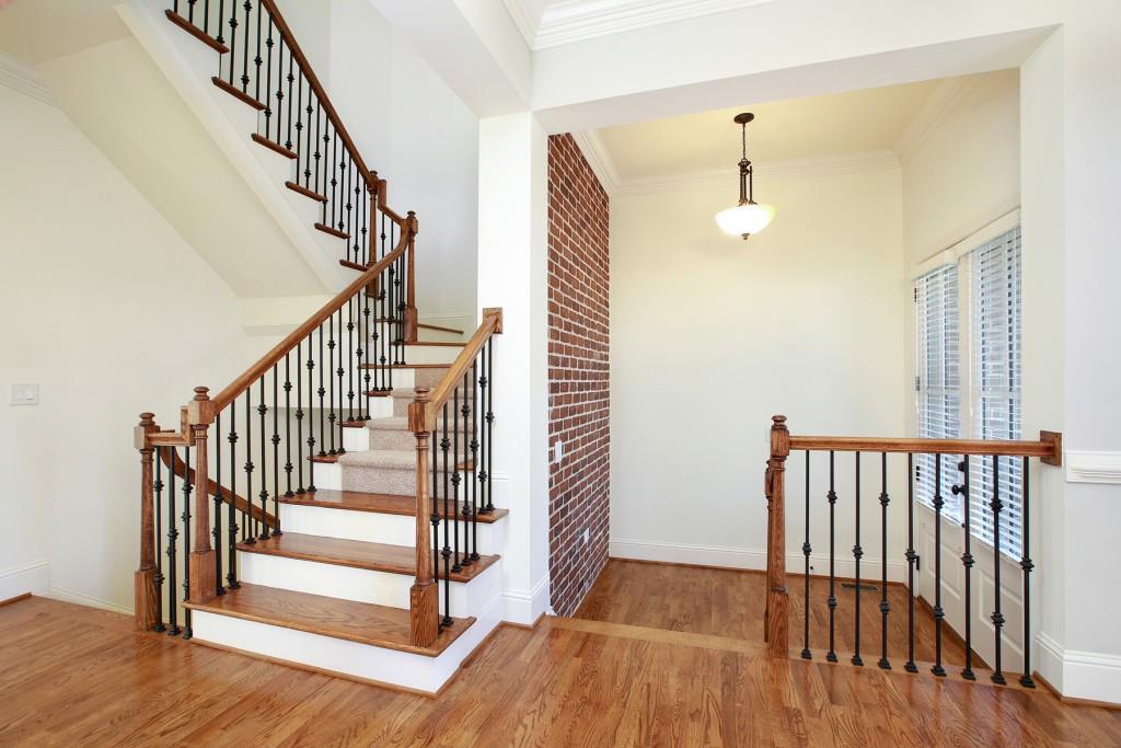 2010 Heathermere Way Roswell, GA 30075 - Photo 8 of 42 a view of staircase with wooden floor and a chandelier