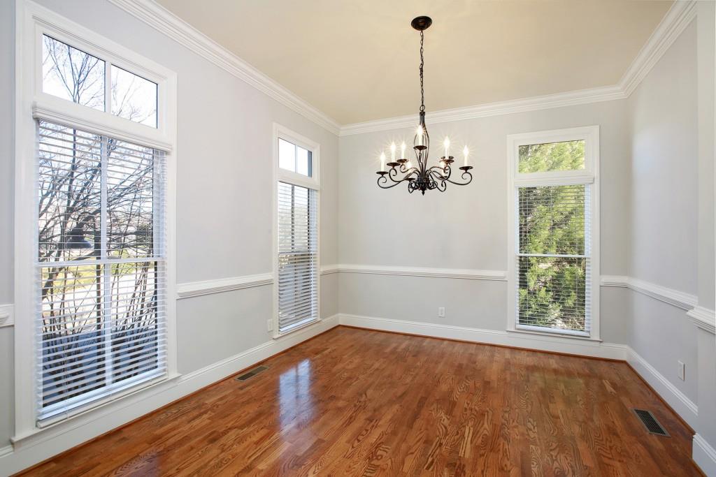 2010 Heathermere Way Roswell, GA 30075 - Photo 9 of 42 a view of an empty room with wooden floor and a window