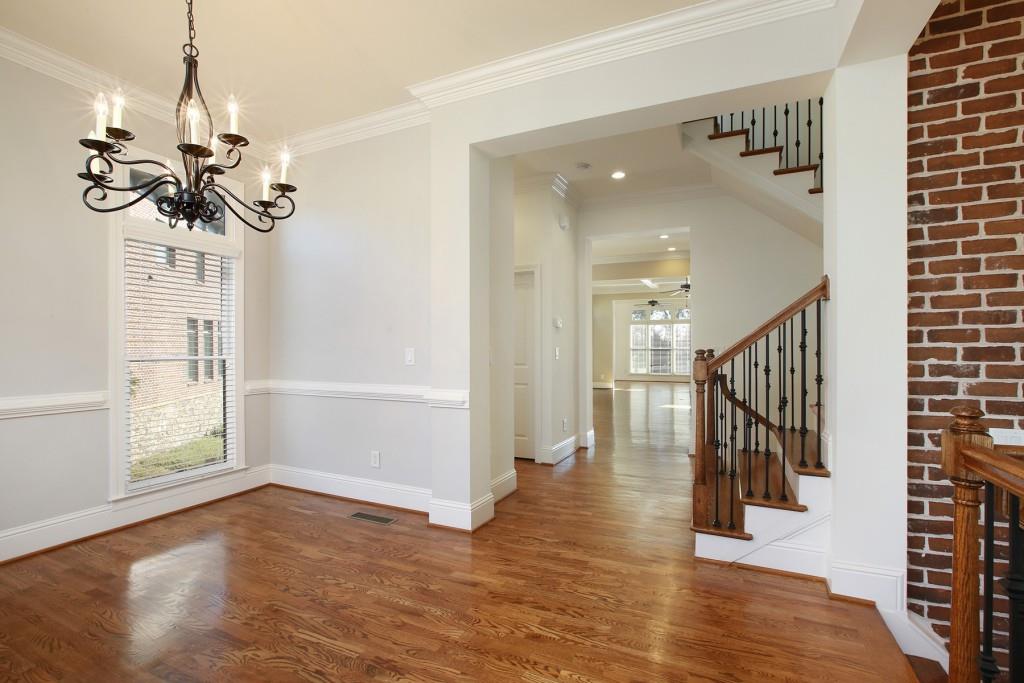 2010 Heathermere Way Roswell, GA 30075 - Photo 10 of 42 a view of an entryway with wooden floor and a chandelier