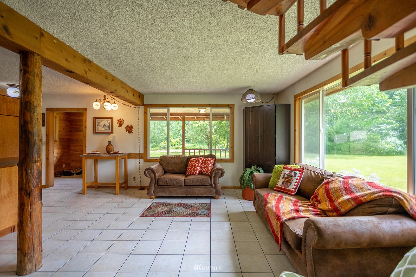1407 Huntley Road Bellingham, WA 98226 - Photo 11 of 39 a living room with furniture and a floor to ceiling window