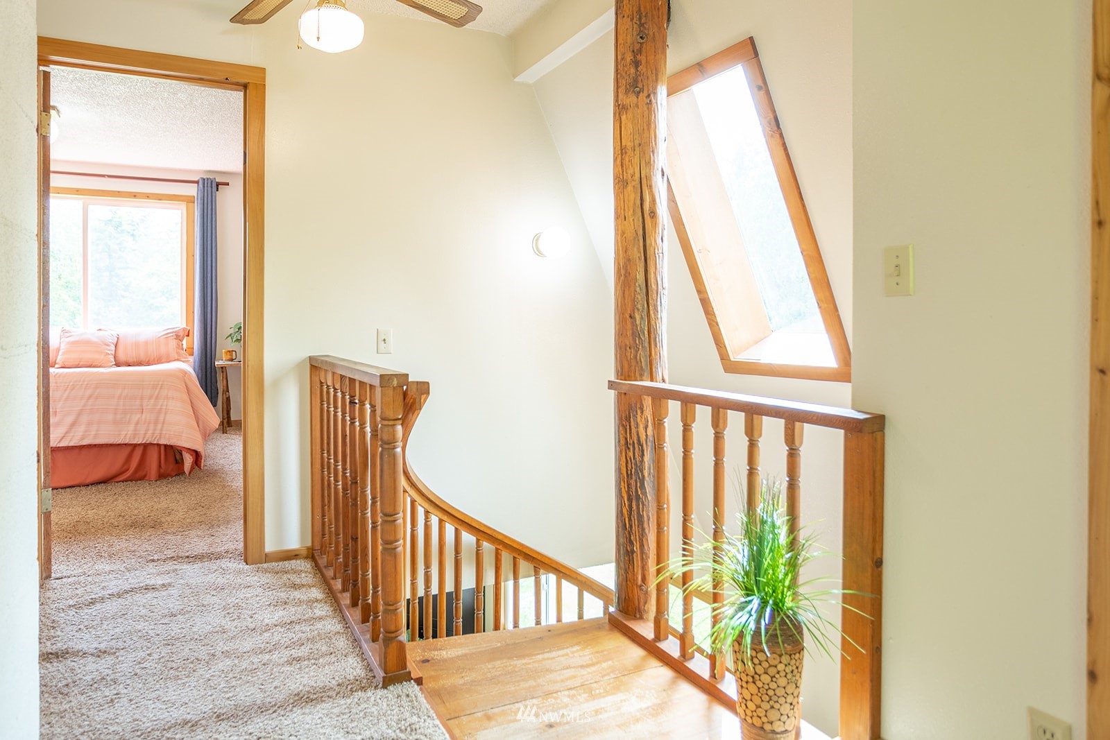 1407 Huntley Road Bellingham, WA 98226 - Photo 15 of 39 a view of a bedroom with wooden floor and door