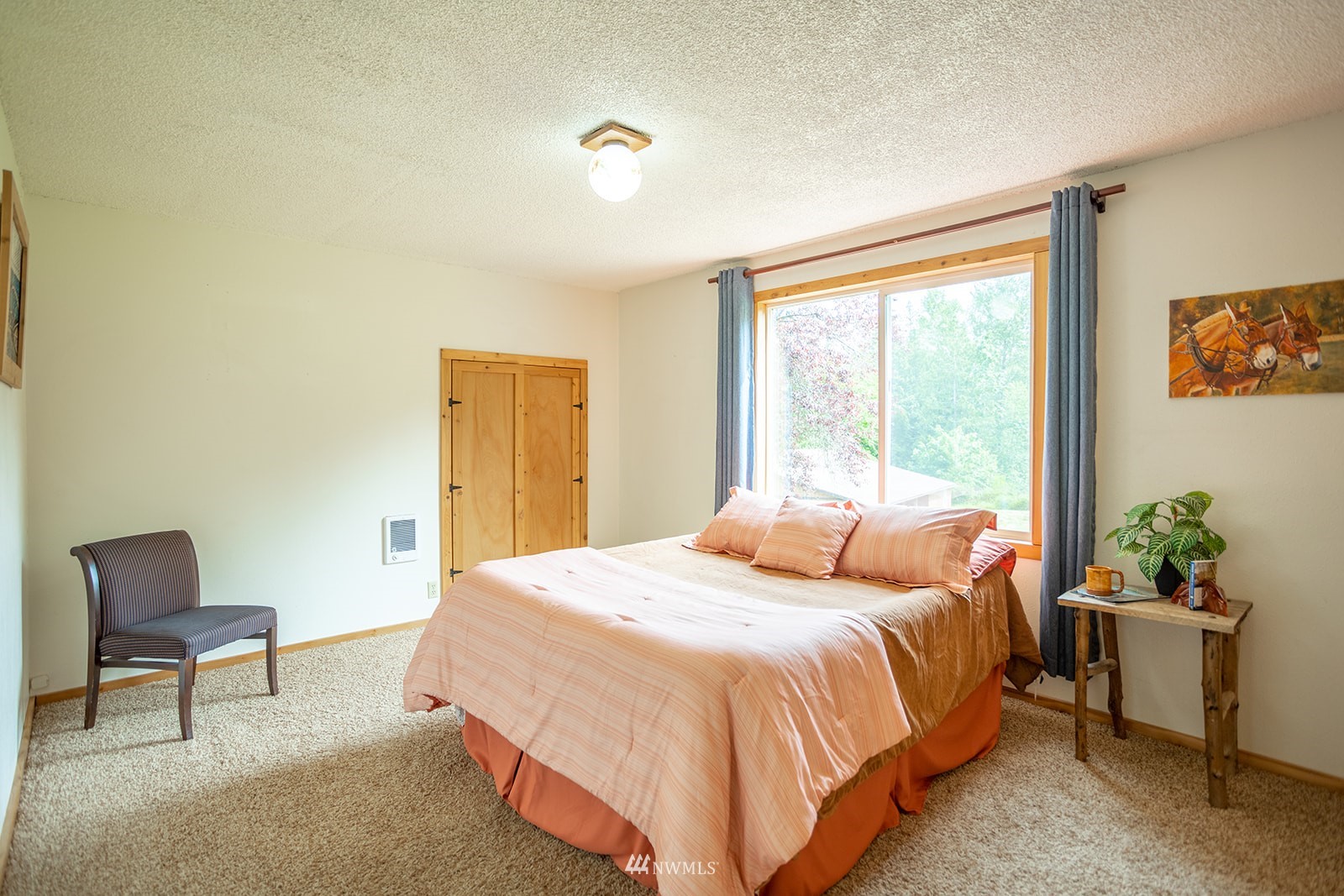 1407 Huntley Road Bellingham, WA 98226 - Photo 19 of 39 a bedroom with a bed and a chair