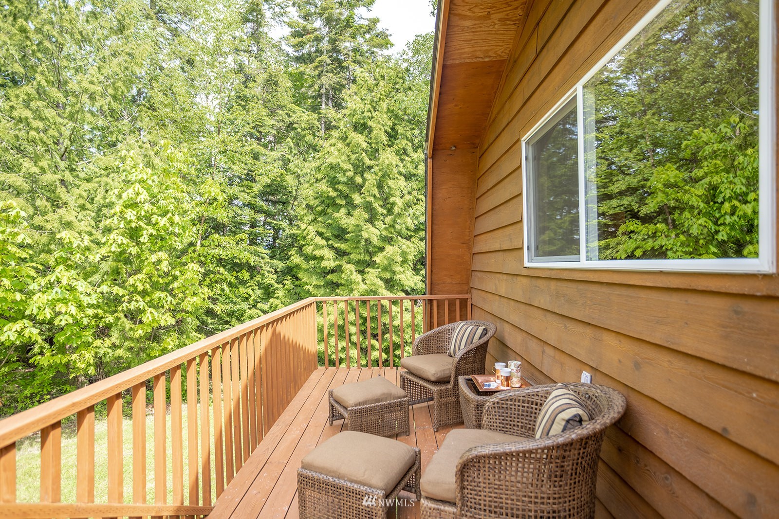 1407 Huntley Road Bellingham, WA 98226 - Photo 22 of 39 a view of a chair and tables in the balcony