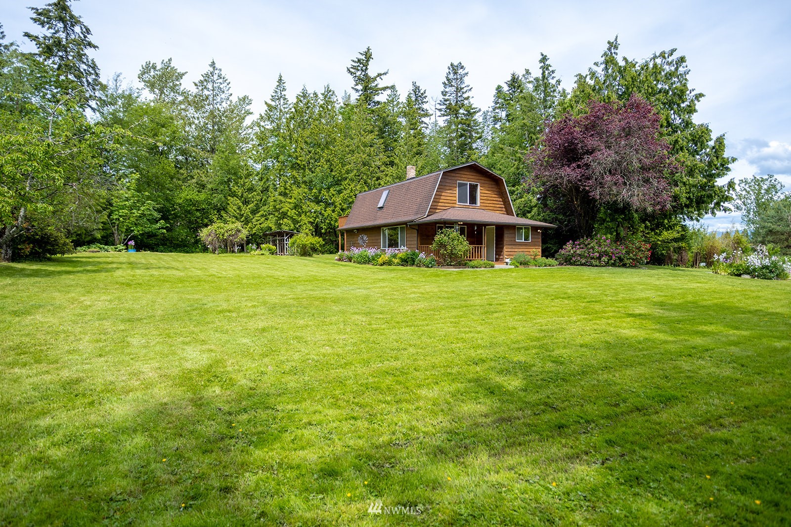 1407 Huntley Road Bellingham, WA 98226 - Photo 27 of 39 a front view of a house with garden