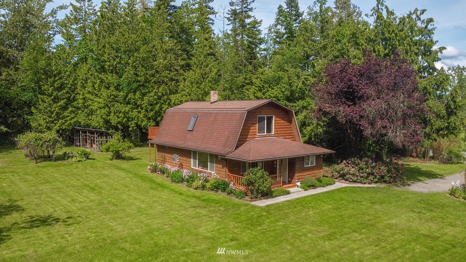 1407 Huntley Road Bellingham, WA 98226 - Photo 4 of 39 a front view of a house with garden