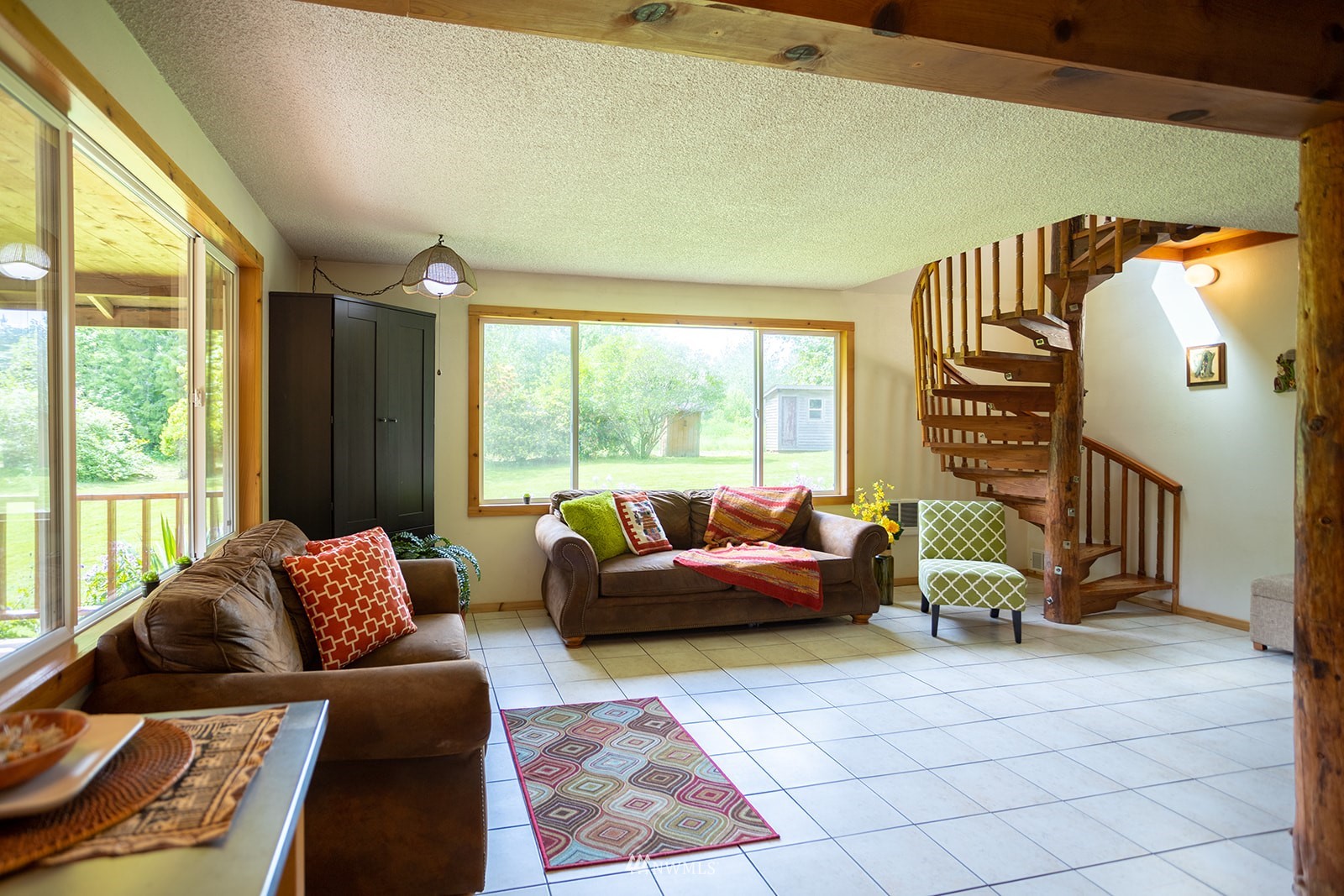 1407 Huntley Road Bellingham, WA 98226 - Photo 9 of 39 a living room with furniture and floor to ceiling windows
