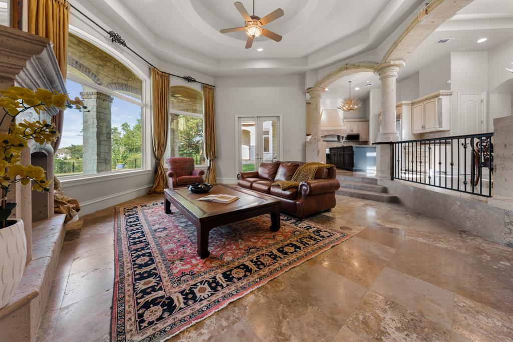 401 Brooks Hollow Road Lakeway, TX 78734 - Photo 18 of 40 a living room with furniture a table and a large window