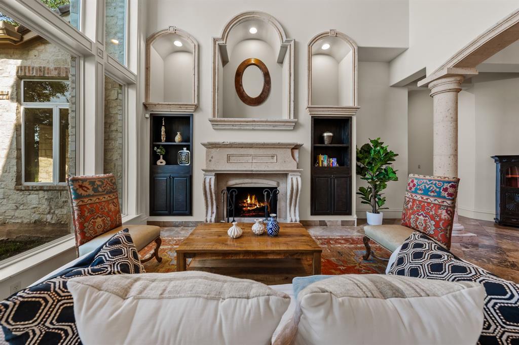 401 Brooks Hollow Road Lakeway, TX 78734 - Photo 2 of 40 a living room with furniture and a fireplace