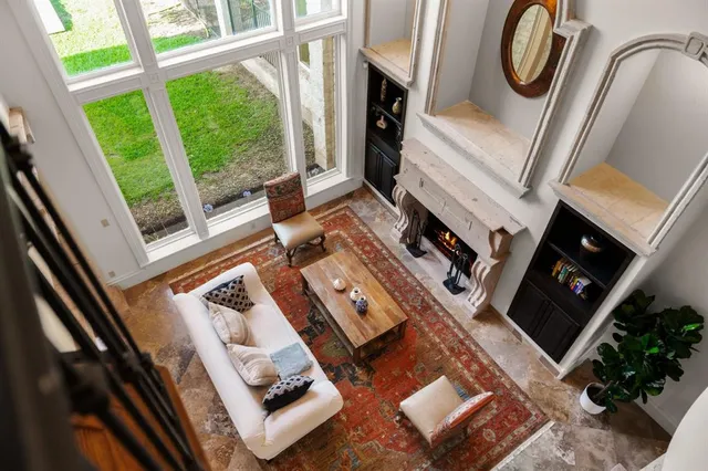a living room with furniture and a fireplace