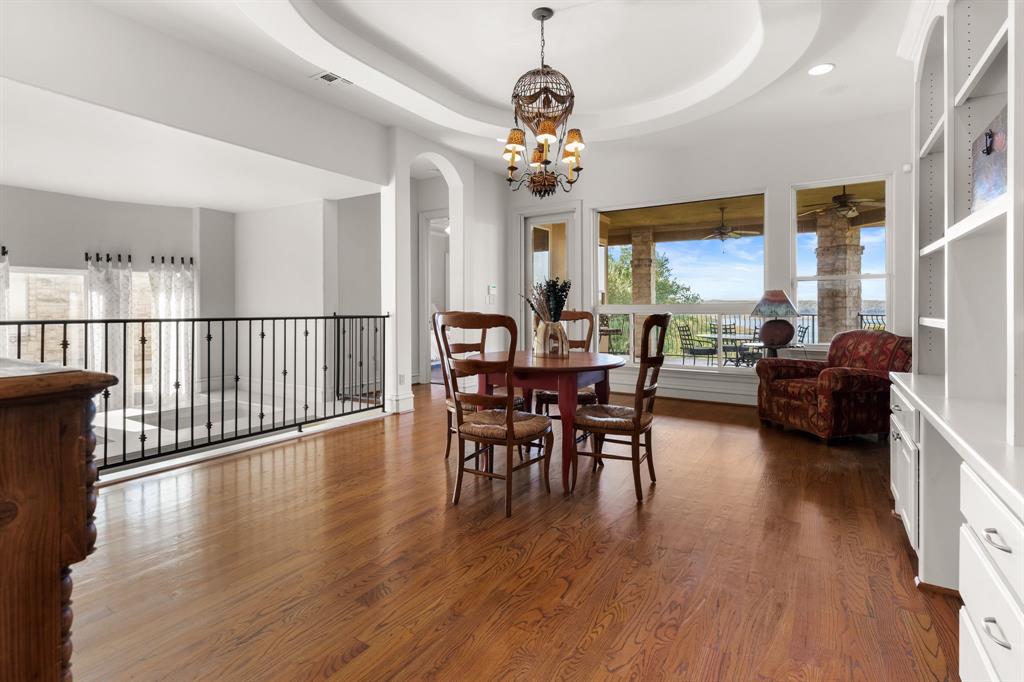 401 Brooks Hollow Road Lakeway, TX 78734 - Photo 27 of 40 a view of a dining room with furniture window and wooden floor
