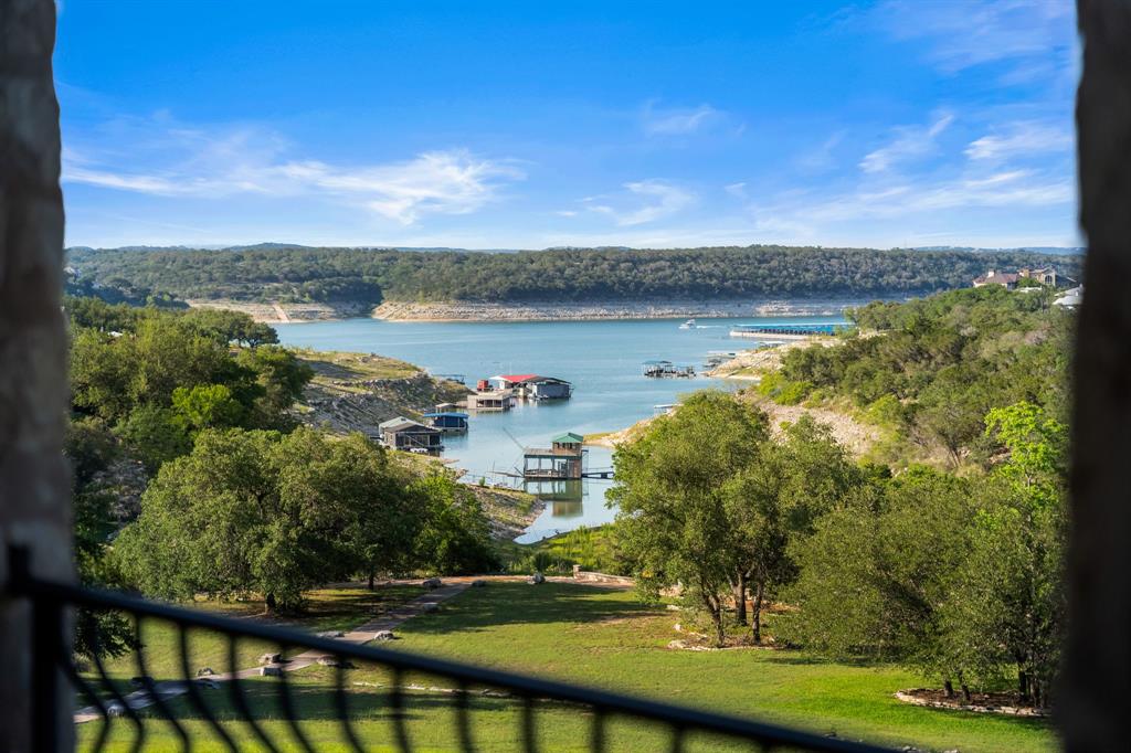401 Brooks Hollow Road Lakeway, TX 78734 - Photo 33 of 40 a view of a lake with a big yard