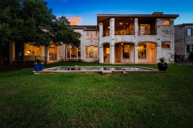 a front view of building with yard and green space