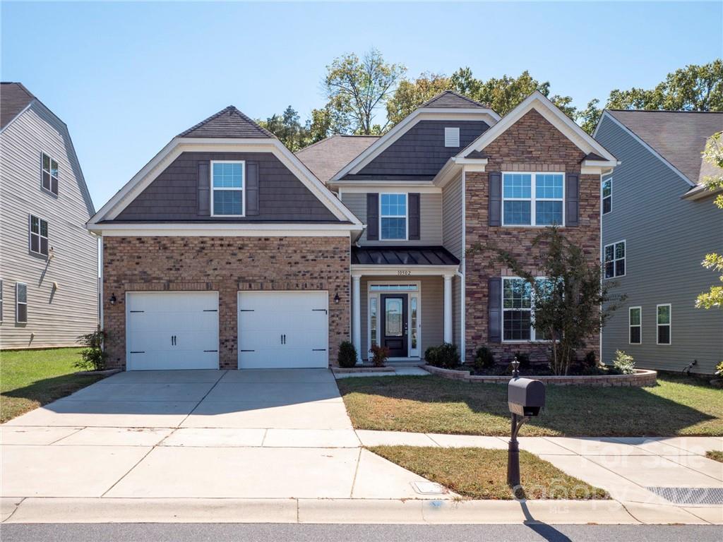 10502 Ebbets Road Charlotte, NC 28273 - Photo 2 of 48 a front view of a house with a yard