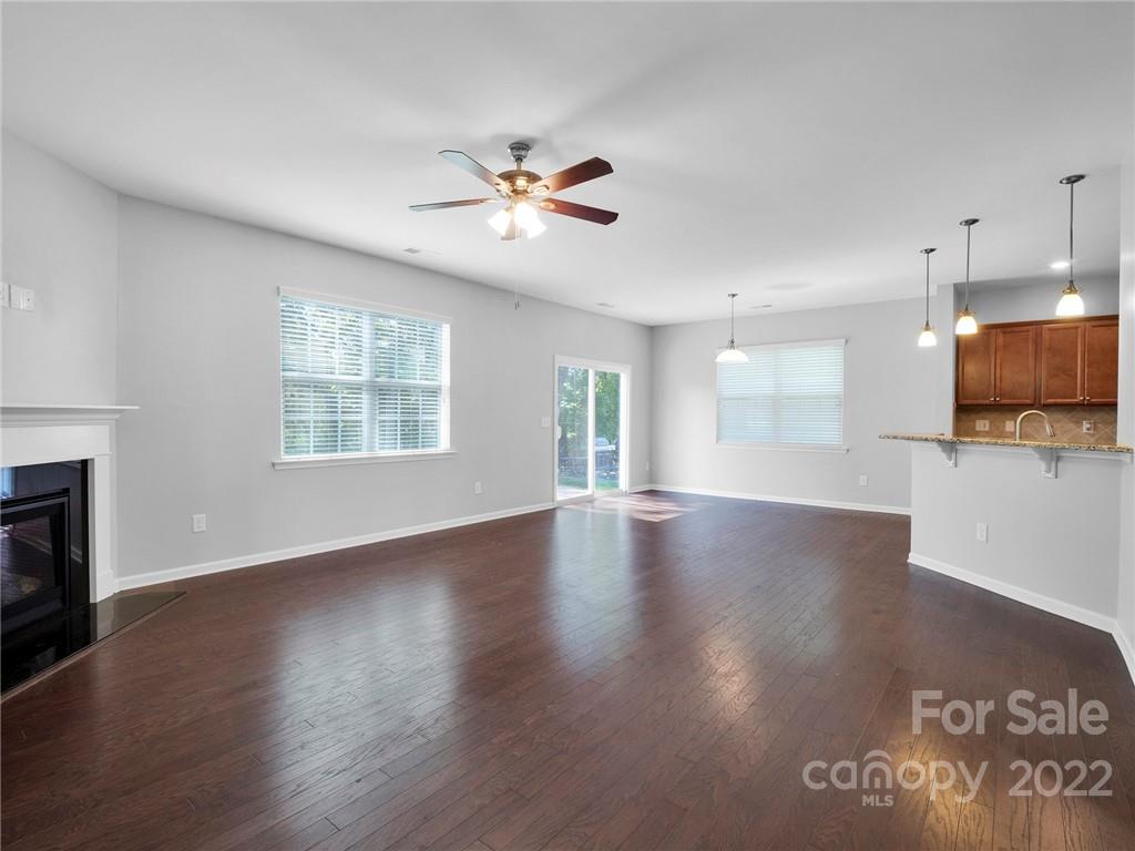 10502 Ebbets Road Charlotte, NC 28273 - Photo 21 of 48 a view of an empty room with wooden floor and a window