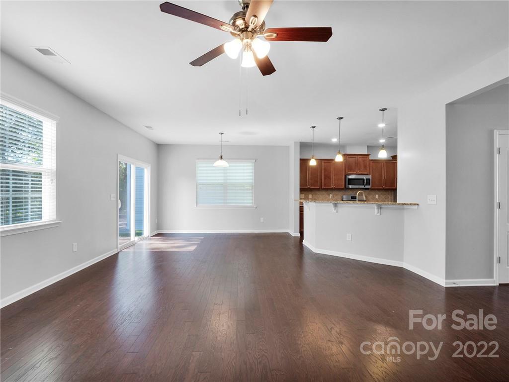 10502 Ebbets Road Charlotte, NC 28273 - Photo 22 of 48 a view of a kitchen with a dishwasher cabinets and wooden floor