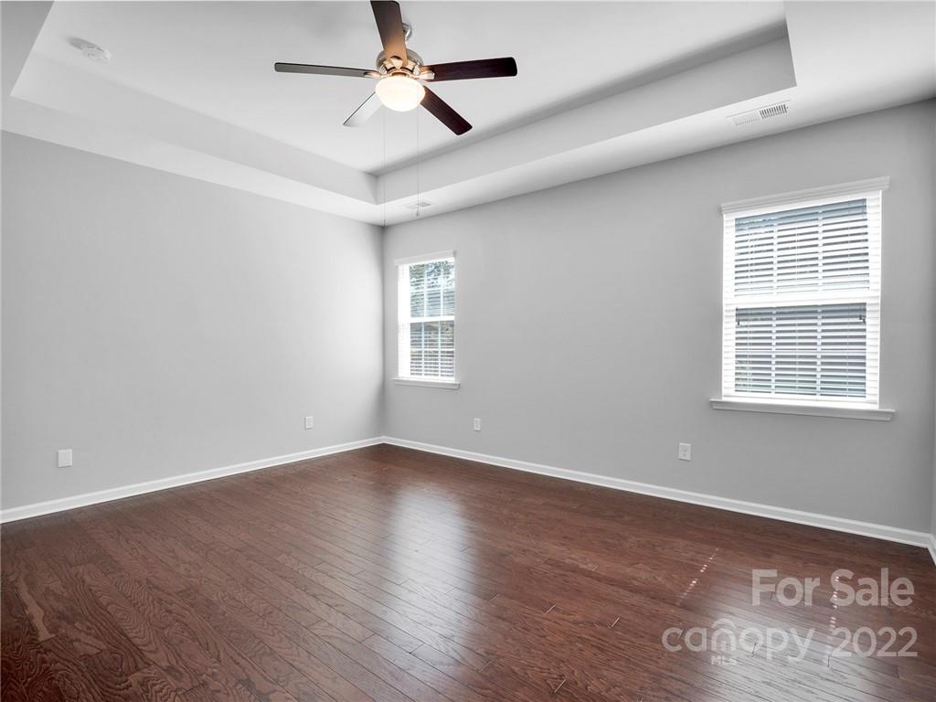 10502 Ebbets Road Charlotte, NC 28273 - Photo 23 of 48 a view of an empty room with a window and wooden floor