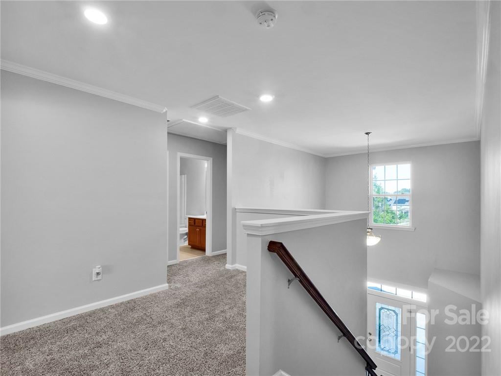 10502 Ebbets Road Charlotte, NC 28273 - Photo 28 of 48 a view of a hallway with stairs